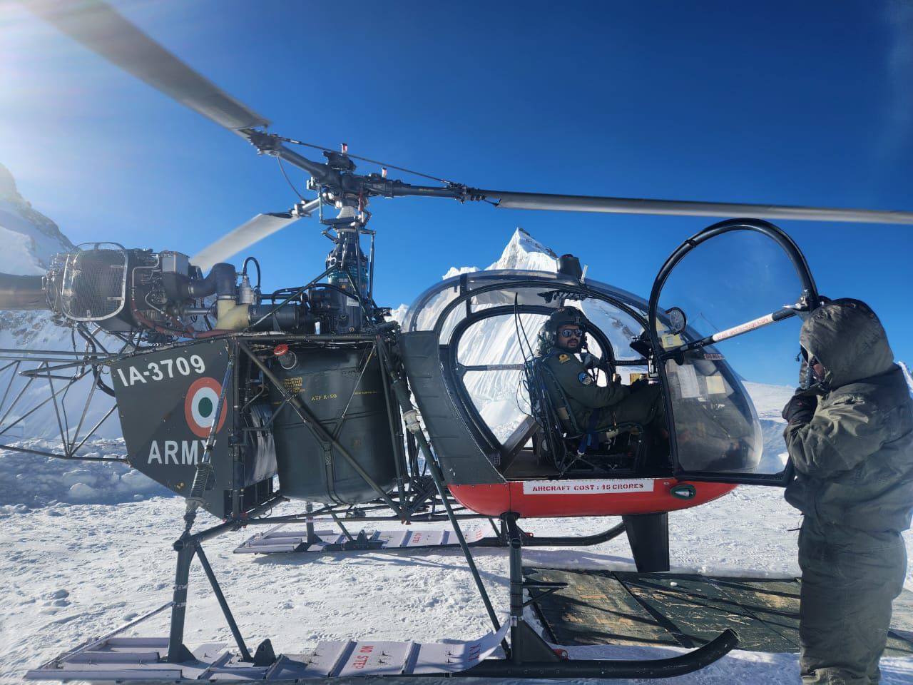 Military helicopter in snowy terrain